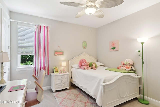 bedroom with baseboards, light carpet, and ceiling fan