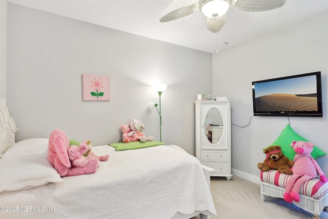 carpeted bedroom with baseboards and ceiling fan