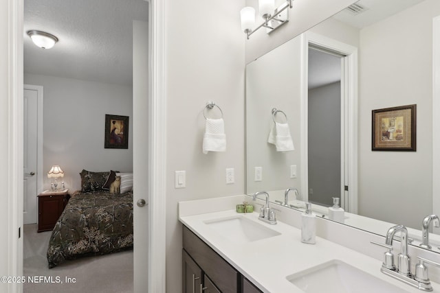 ensuite bathroom featuring double vanity