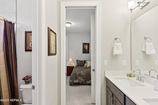 ensuite bathroom featuring double vanity