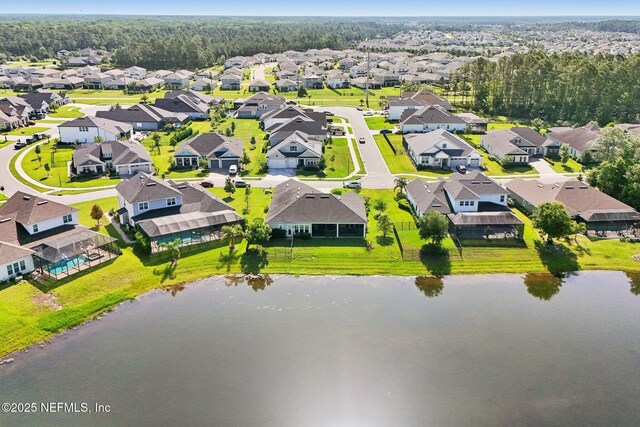 aerial perspective of suburban area featuring a large body of water