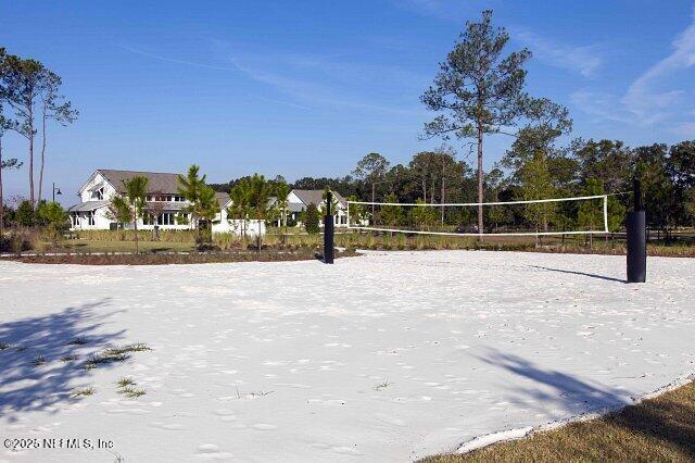 view of home's community with volleyball court