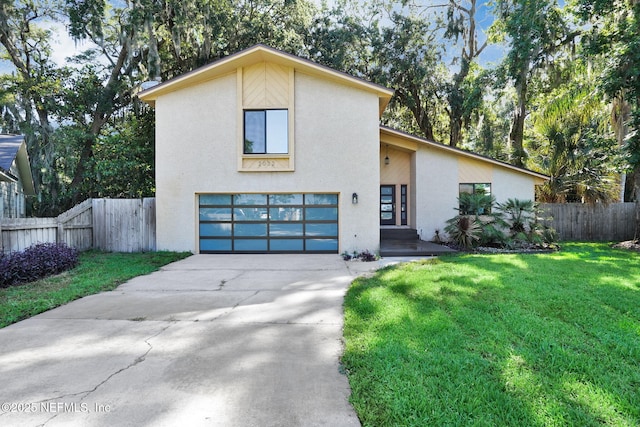2032 Sandpiper Pt, Neptune Beach, FL 32266 - view of front of home featuring a garage, stucco siding, and concrete driveway