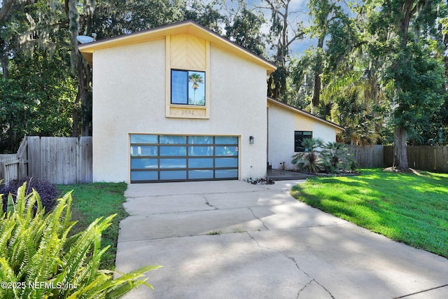 2032 Sandpiper Pt, Neptune Beach, FL 32266 - view of front of property featuring a garage, driveway, and stucco siding