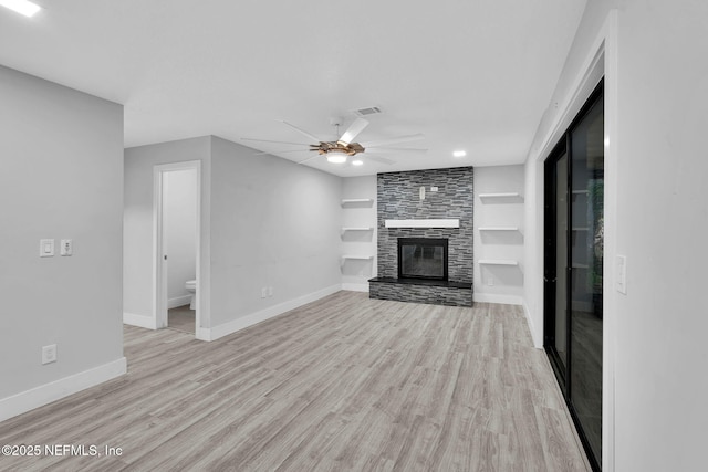 2032 Sandpiper Pt, Neptune Beach, FL 32266 - unfurnished living room with light wood-style flooring, built in features, ceiling fan, a fireplace, and recessed lighting