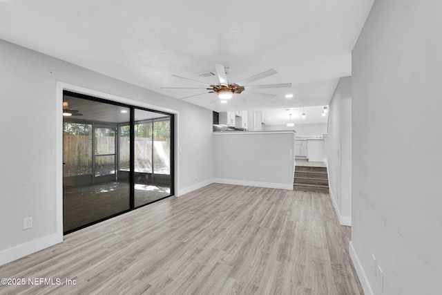 2032 Sandpiper Pt, Neptune Beach, FL 32266 - unfurnished living room with ceiling fan and wood finished floors