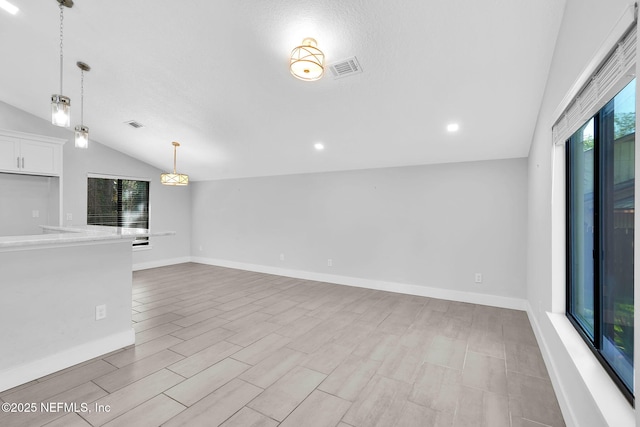 2032 Sandpiper Pt, Neptune Beach, FL 32266 - unfurnished living room featuring lofted ceiling, light wood-type flooring, and recessed lighting