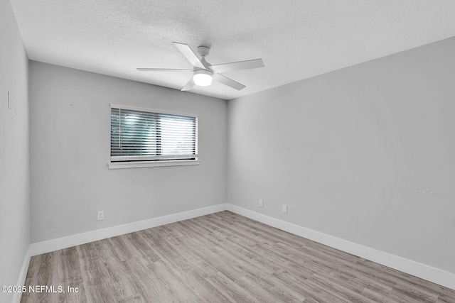 2032 Sandpiper Pt, Neptune Beach, FL 32266 - empty room with wood finished floors, a textured ceiling, and ceiling fan