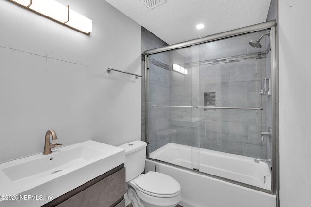 2032 Sandpiper Pt, Neptune Beach, FL 32266 - full bath featuring combined bath / shower with glass door, vanity, and a textured ceiling