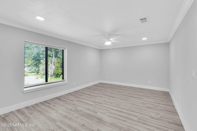 2032 Sandpiper Pt, Neptune Beach, FL 32266 - spare room featuring a ceiling fan, light wood-type flooring, ornamental molding, and a textured ceiling