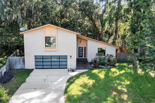 2032 Sandpiper Pt, Neptune Beach, FL 32266 - mid-century home with stucco siding, an attached garage, and concrete driveway