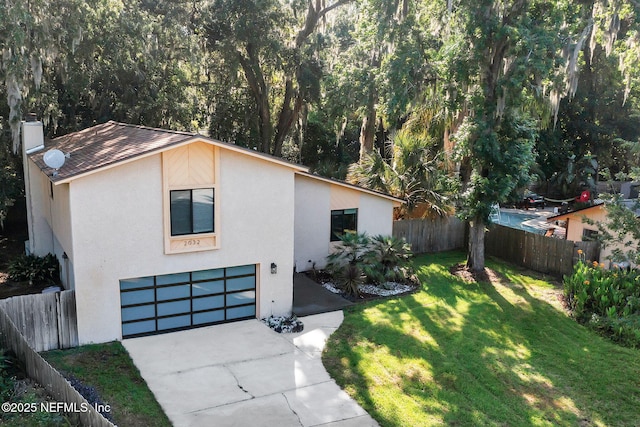2032 Sandpiper Pt, Neptune Beach, FL 32266 - view of front of house with a garage, stucco siding, concrete driveway, and a chimney