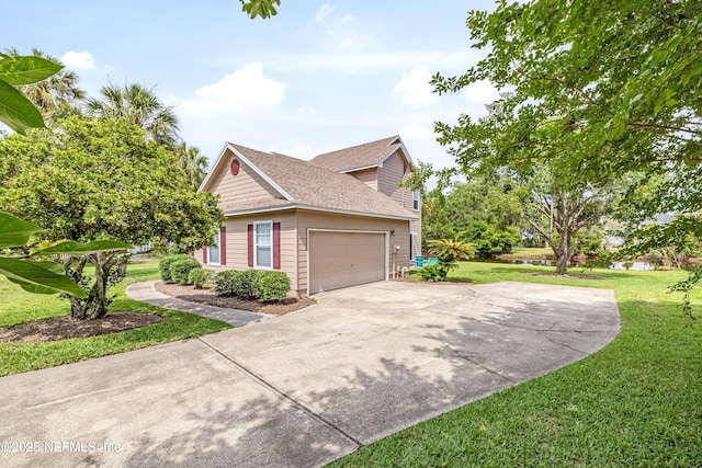 view of property exterior with a yard, driveway, an attached garage, a water view, and roof with shingles