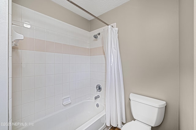 bathroom with a textured ceiling, shower / bath combination with curtain, and toilet