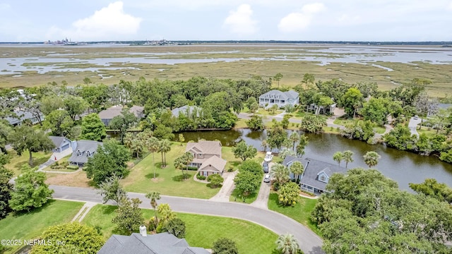 aerial perspective of suburban area with a large body of water