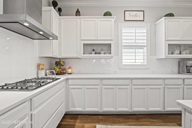 131 Seabrook Dr, Ponte Vedra, FL 32081 - kitchen with wall chimney exhaust hood, stainless steel gas cooktop, white cabinets, and ornamental molding