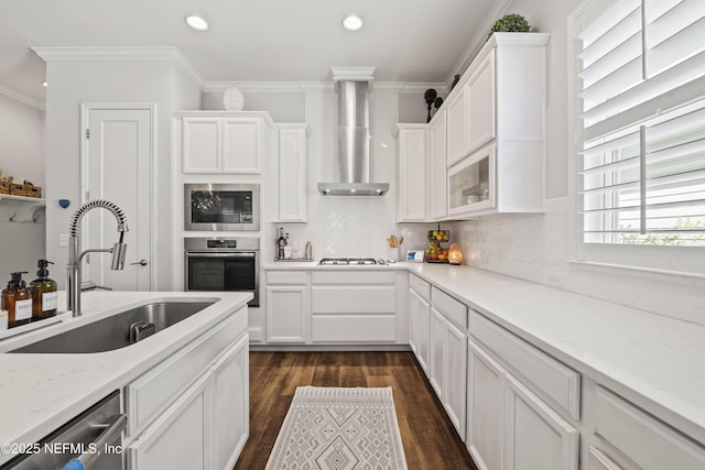 131 Seabrook Dr, Ponte Vedra, FL 32081 - kitchen featuring wall chimney range hood, a sink, stainless steel appliances, white cabinetry, and ornamental molding