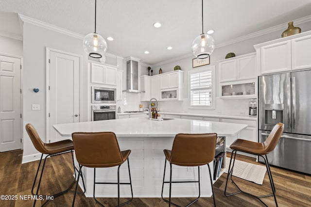 131 Seabrook Dr, Ponte Vedra, FL 32081 - kitchen featuring appliances with stainless steel finishes, wall chimney exhaust hood, a sink, white cabinets, and ornamental molding
