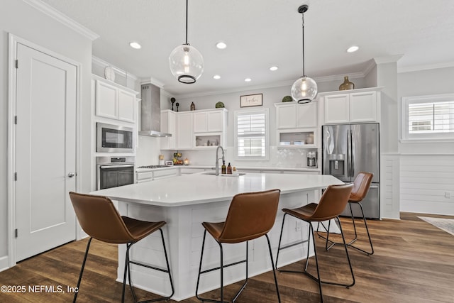 131 Seabrook Dr, Ponte Vedra, FL 32081 - kitchen featuring stainless steel appliances, wall chimney range hood, a sink, light countertops, and white cabinets