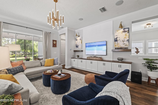 131 Seabrook Dr, Ponte Vedra, FL 32081 - living area with crown molding, dark wood-type flooring, a textured ceiling, a chandelier, and baseboards
