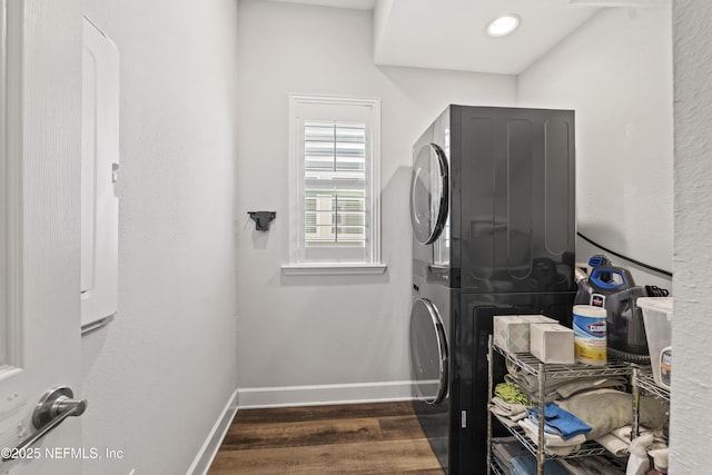 131 Seabrook Dr, Ponte Vedra, FL 32081 - laundry room with stacked washer / dryer, dark wood finished floors, and baseboards