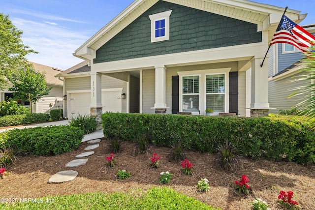 131 Seabrook Dr, Ponte Vedra, FL 32081 - craftsman house featuring a garage, covered porch, and driveway