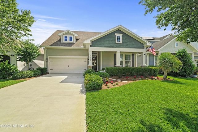 131 Seabrook Dr, Ponte Vedra, FL 32081 - craftsman house featuring a front yard, a garage, concrete driveway, a shingled roof, and covered porch