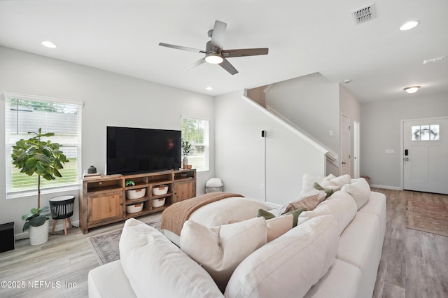 2483 Cortez Rd, Jacksonville, FL 32246 - living area featuring stairway, light wood-type flooring, ceiling fan, recessed lighting, and baseboards