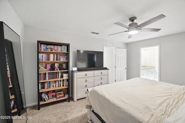 2483 Cortez Rd, Jacksonville, FL 32246 - bedroom with light colored carpet, connected bathroom, baseboards, and ceiling fan