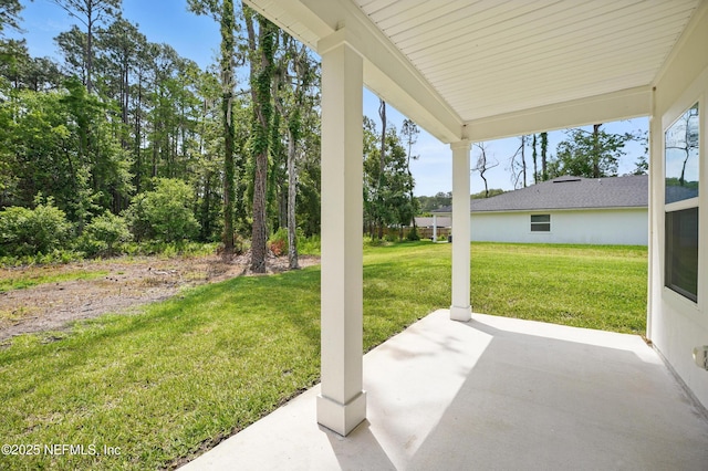 2483 Cortez Rd, Jacksonville, FL 32246 - view of green lawn with a patio area