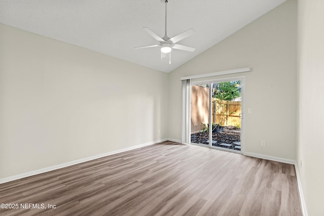 2492 Whispering Woods Blvd Unit 1, Jacksonville, FL 32246 - spare room with wood finished floors, a ceiling fan, high vaulted ceiling, and baseboards