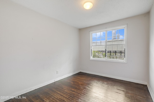 330 W 26th St, Jacksonville, FL 32206 - unfurnished room with baseboards and hardwood / wood-style flooring