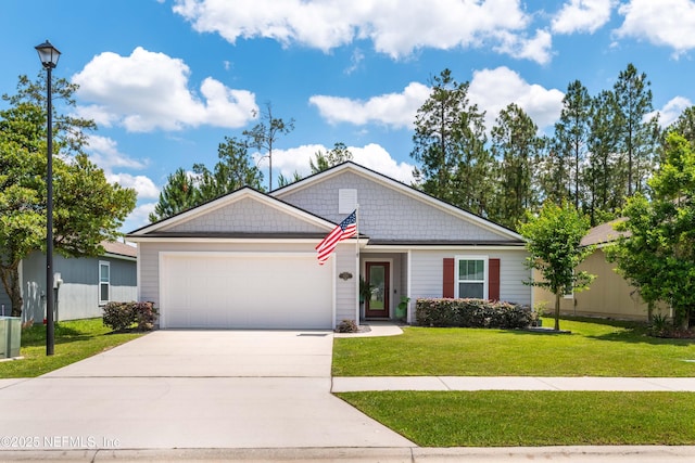 4328 Packer Meadow Way, Middleburg, FL 32068 - view of front of home featuring a garage, driveway, and a front yard