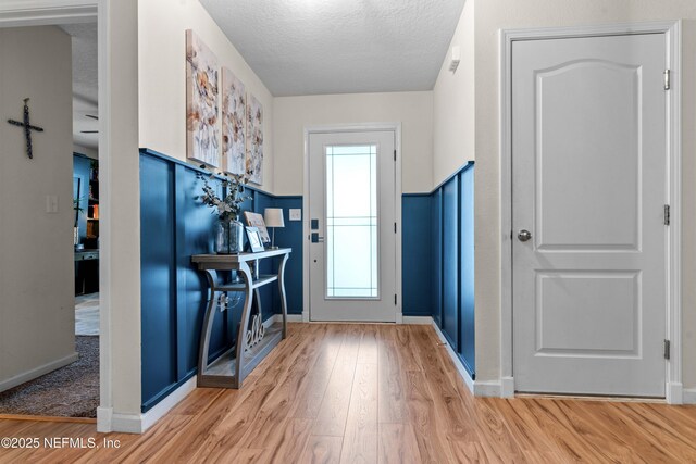 4328 Packer Meadow Way, Middleburg, FL 32068 - entrance foyer with wood finished floors, a textured ceiling, and baseboards