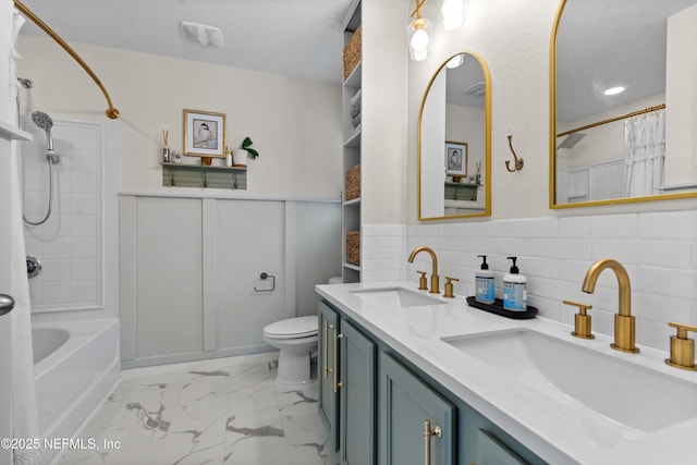 4328 Packer Meadow Way, Middleburg, FL 32068 - bathroom with double vanity, shower / bath combo, toilet, marble finish floors, and decorative backsplash