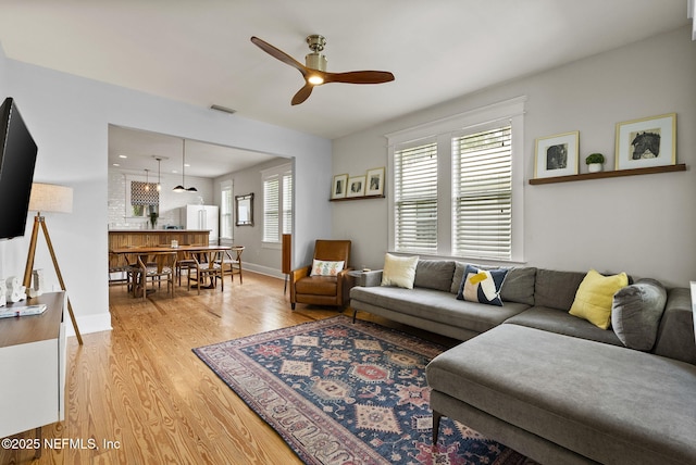 206 Cabeza St, Saint Augustine, FL 32080 - living area with a ceiling fan, light wood finished floors, and baseboards