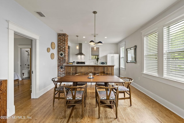 206 Cabeza St, Saint Augustine, FL 32080 - dining room with light wood-style floors, baseboards, a chandelier, and recessed lighting