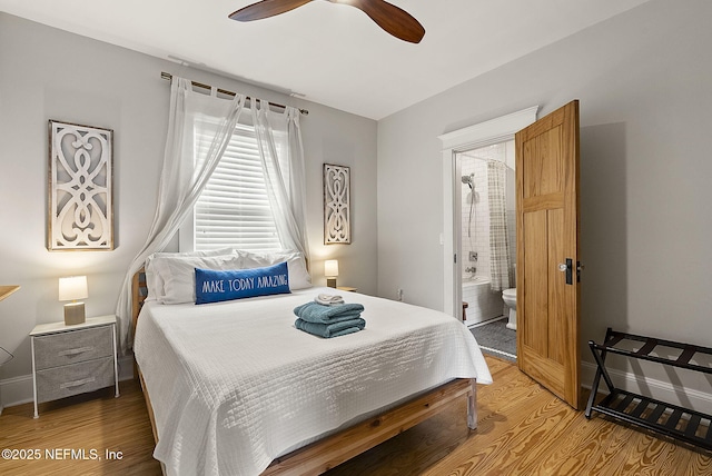 206 Cabeza St, Saint Augustine, FL 32080 - bedroom featuring wood finished floors, ensuite bath, baseboards, and a ceiling fan