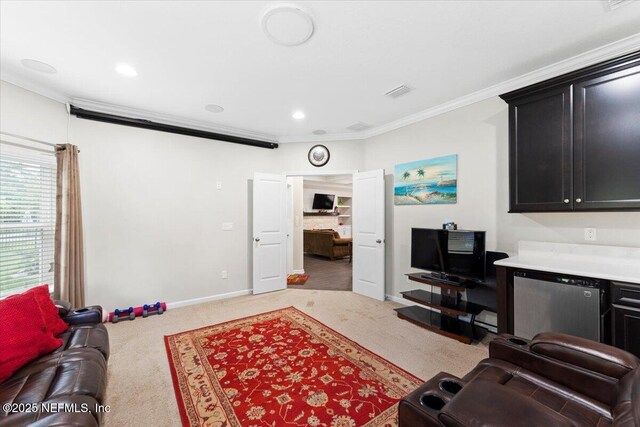 carpeted living area featuring crown molding, baseboards, and recessed lighting
