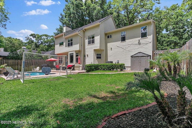 11921 Loretto Square Dr S, Jacksonville, FL 32223 - back of property featuring a patio, a chimney, a storage unit, and an outdoor structure