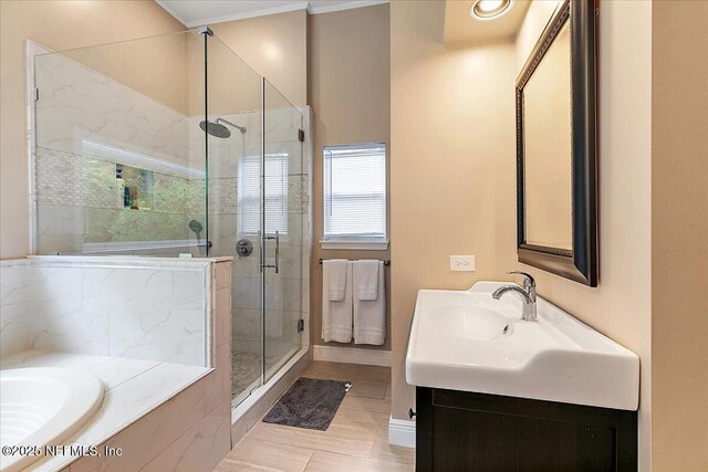 11921 Loretto Square Dr S, Jacksonville, FL 32223 - bathroom with a stall shower, a bath, vanity, baseboards, and tile patterned floors