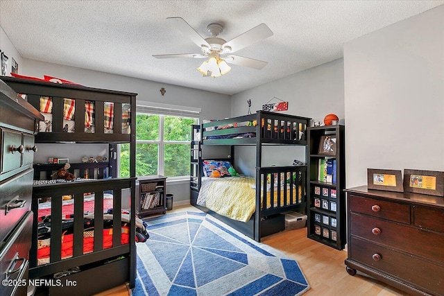 11921 Loretto Square Dr S, Jacksonville, FL 32223 - bedroom featuring wood finished floors, a textured ceiling, and a ceiling fan