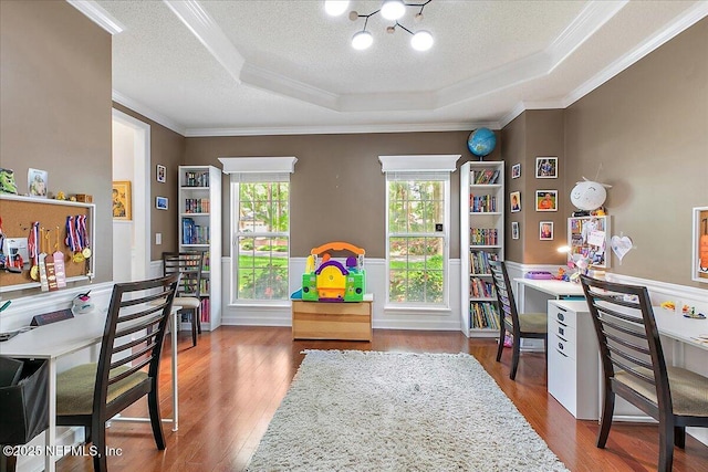 11921 Loretto Square Dr S, Jacksonville, FL 32223 - office space with crown molding, a tray ceiling, a chandelier, a wainscoted wall, and wood finished floors
