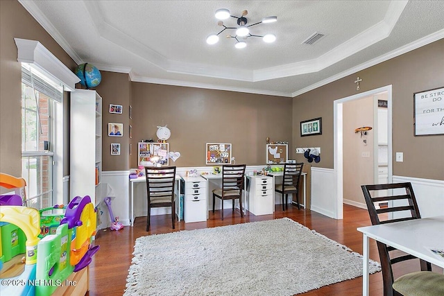11921 Loretto Square Dr S, Jacksonville, FL 32223 - home office featuring a raised ceiling, crown molding, dark wood-type flooring, a chandelier, and a wainscoted wall