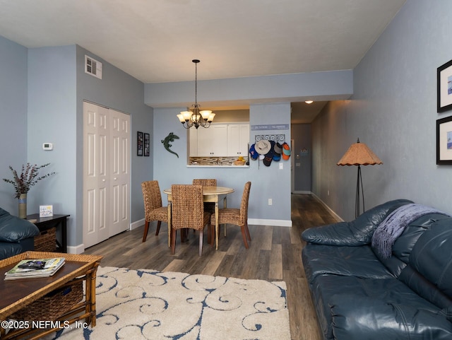 21126 NE 101st Ave, Melrose, FL 32666 - dining area featuring a chandelier, dark wood-style floors, and baseboards