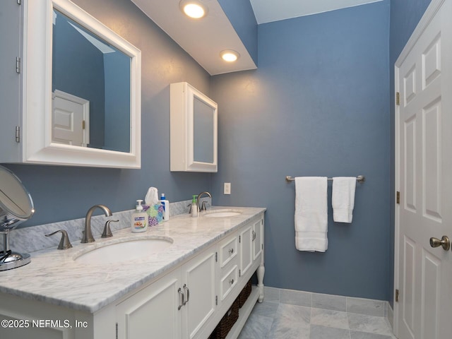 21126 NE 101st Ave, Melrose, FL 32666 - bathroom with baseboards, double vanity, and recessed lighting