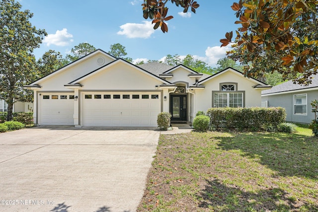 1009 Welaka Way, Saint Augustine, FL 32092 - ranch-style house with driveway, a garage, stucco siding, and a front lawn