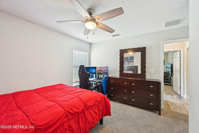 1009 Welaka Way, Saint Augustine, FL 32092 - bedroom with light carpet, a textured ceiling, and ceiling fan