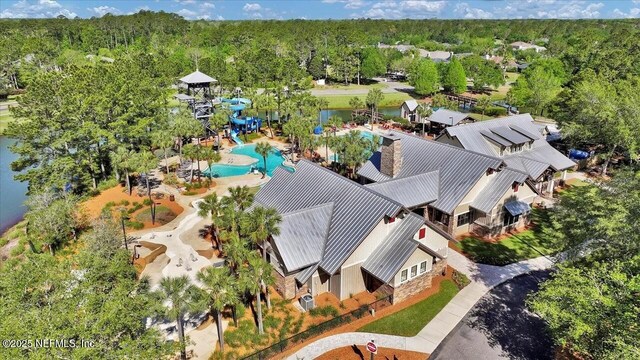 1009 Welaka Way, Saint Augustine, FL 32092 - aerial view of property and surrounding area featuring a pool and a forest