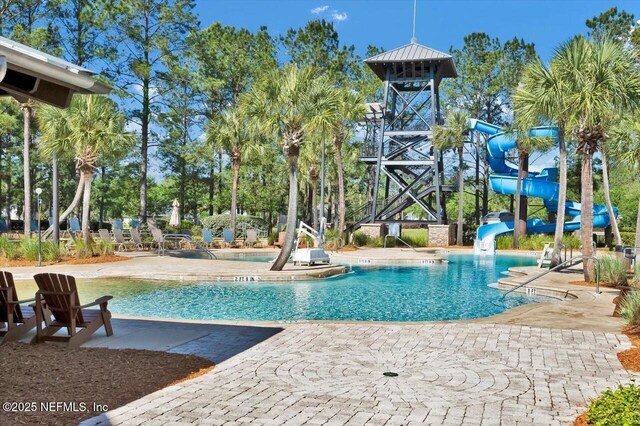 1009 Welaka Way, Saint Augustine, FL 32092 - community pool with a water slide and a patio area
